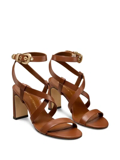 Stuart Weitzman Buckle-embellished Crossover Sandals In Brown