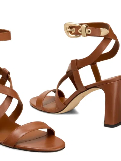 Stuart Weitzman Buckle-embellished Crossover Sandals In Brown