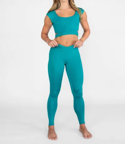 Body Wrappers Recycled Poly Criss Cross Waist Band Legging With Back Pocket In Teal In Blue
