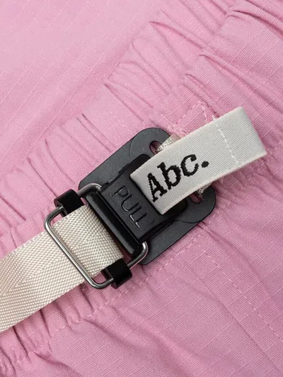 Advisory Board Crystals Pull-tab Pocketed Shorts In Pink