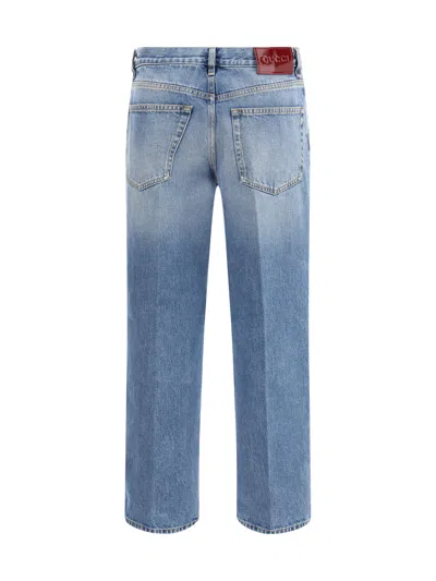 Gucci Blue Jeans With Logo Patch On The Rear And Faded Effect In Denim Woman
