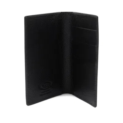 Tod's Textured Finish Wallets For A Sophisticated Look In Black