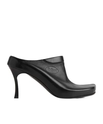 Balenciaga Debossed Logo Heeled Mules In Black