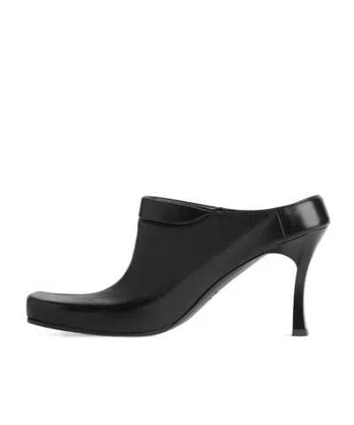 Balenciaga Debossed Logo Heeled Mules In Black