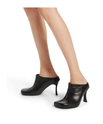 Balenciaga Debossed Logo Heeled Mules In Black