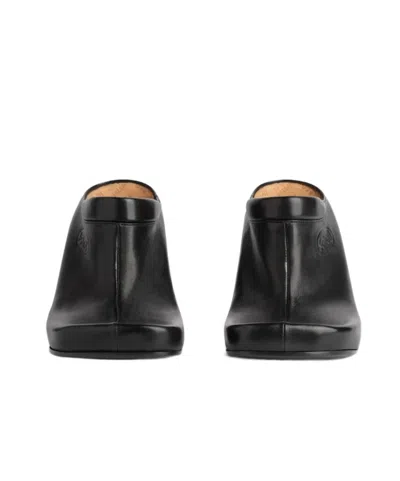 Balenciaga Debossed Logo Heeled Mules In Black