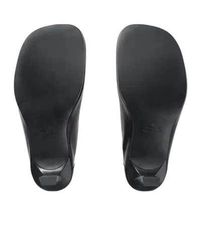 Balenciaga Debossed Logo Heeled Mules In Black
