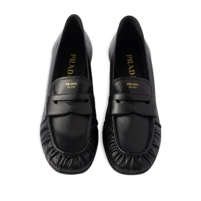 Prada Rounded Toe Loafers With Textured Detailing And Low Block Heel In Black