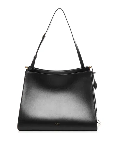 Alaïa Le Click Medium Curve Shoulder Bag In Glossy Leather In Black