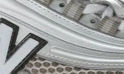 New Balance Contemporary Sneakers Featuring Mesh Panels And Reflective Accents In White