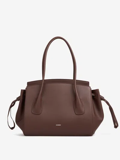 Jil Sander Voyage Drawstring Leather Tote Bag In Brown