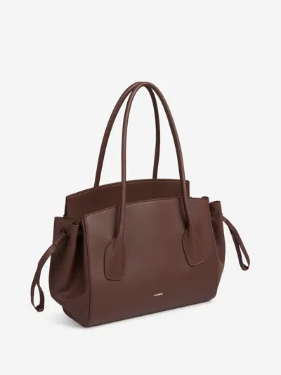 Jil Sander Voyage Drawstring Leather Tote Bag In Brown