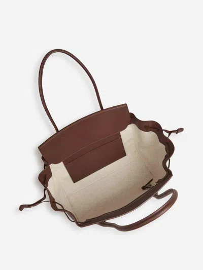 Jil Sander Voyage Drawstring Leather Tote Bag In Brown