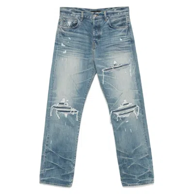 Amiri Men Blue Jeans With Ripped Details On The Front And Logo Patch On The Rear In Denim Man In Blue