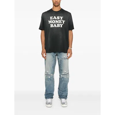 Amiri Men Blue Jeans With Ripped Details On The Front And Logo Patch On The Rear In Denim Man In Blue