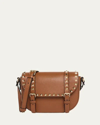 Valentino Small Rockstud Leather Saddle Crossbody Bag In Brown