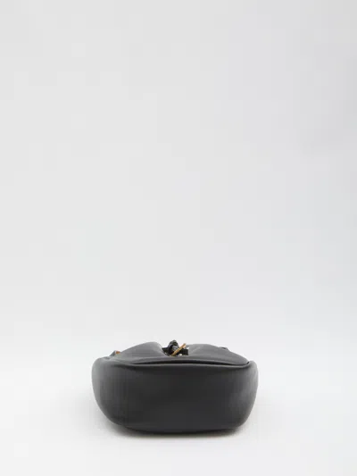 Saint Laurent Cassandre Drawstring Leather Shoulder Bag In Black