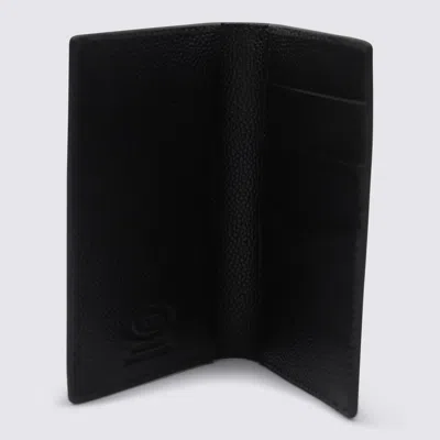 Tod's Textured Finish Wallets For A Sophisticated Look In Black