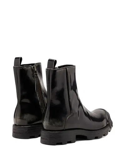 拉链细节椭圆形标牌短靴