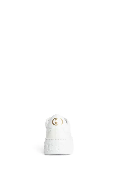 Gucci Gg Embossed Low-top Sneakers In White