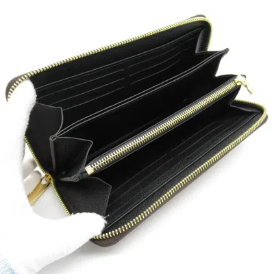 Pre-owned Louis Vuitton Brown Coated Canvas Monogram Pvc Leather Long Wallet (bi-fold) ()