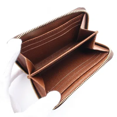 Pre-owned Louis Vuitton Brown Coated Canvas Pvc Monogram Coin Purse/coin Case ()