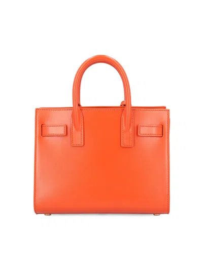 Saint Laurent Sac De Jour Nano Top-handle Bag In Smooth Leather In Orange
