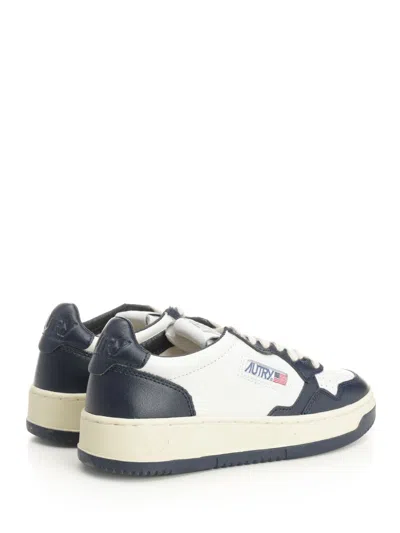 Autry Low-top Leather Sneakers With Navy Overlays And Perforated Details In Black
