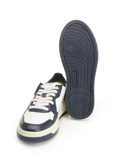 Autry Low-top Leather Sneakers With Navy Overlays And Perforated Details In Black