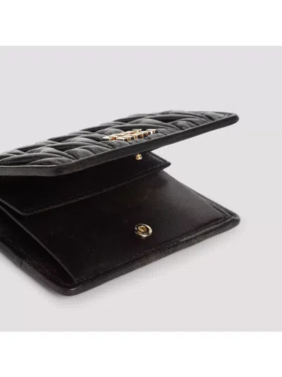 Miu Miu Quilted Leather Wallet With Lettering Logo On The Front In Black