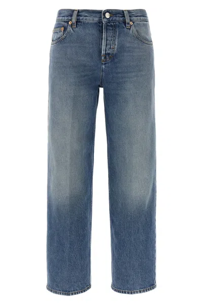 Gucci Blue Jeans With Logo Patch On The Rear And Faded Effect In Denim Woman