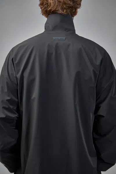 Essentials Long Nylon Jacket With Logo Patch. In Black