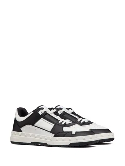 Valentino Garavani 'freedots' White And Black Low Top Sneakers With Studs In Leather Man