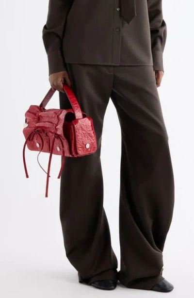 Acne Studios Multipocket Crinkle Patent Leather Top Handle Bag In Red