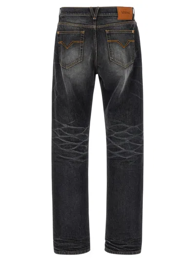 Versace Denim Jeans With Faded Effect And Contrast Stitching In Gray
