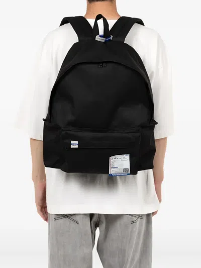 In・stru(men-tal) Label-detail Backpack In Black