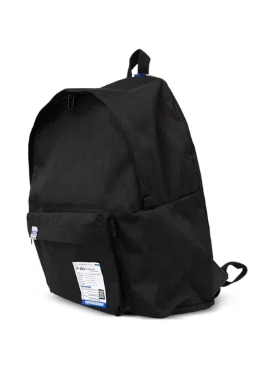 In・stru(men-tal) Label-detail Backpack In Black