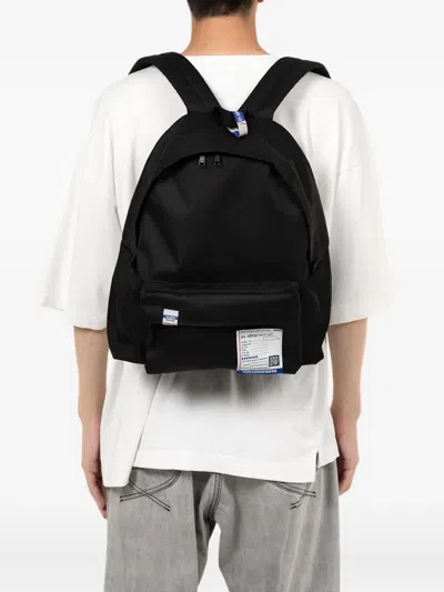 In・stru(men-tal) Label-detail Backpack In Black