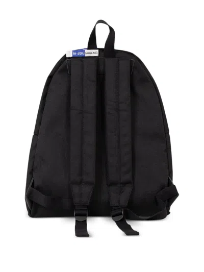 In・stru(men-tal) Label-detail Backpack In Black