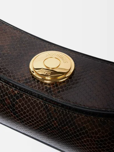 Jacquemus Ovalo Clutch In Brown