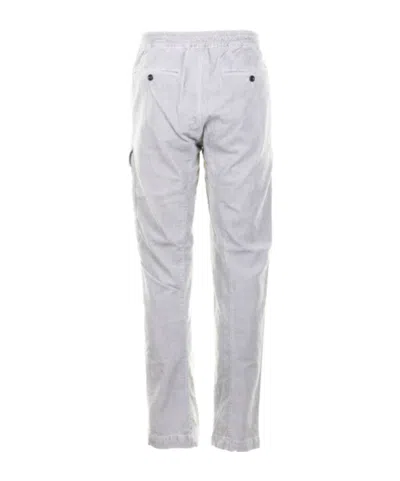 C.p. Company Relaxed-fit Cargo Pants With Multiple Pockets And Circular Patch Detail In Blue