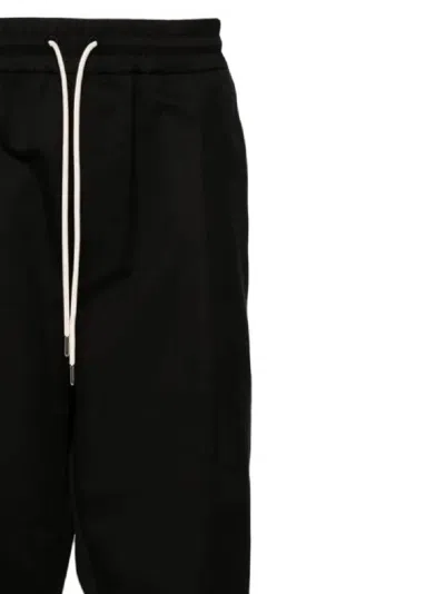 Drôle De Monsieur Black Carrot Pants With Drawstring In Wool Blend Man In Black