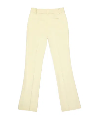 Frame Le Mini Boot Flared Trousers In Yellow