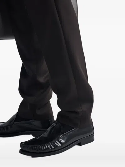 Prada Pleated-front Wool Trousers In Black