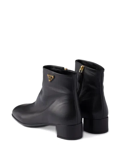 Prada Triangle-logo Zip Ankle Boots In Black
