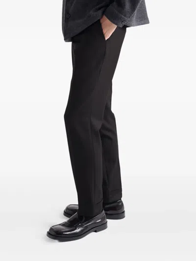 Prada Triangle-logo Wool Trousers In Black