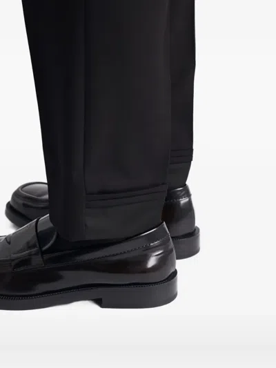 Prada Triangle-logo Wool Trousers In Black