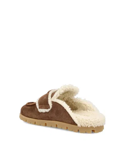 Prada Round Toe Suede Mules With Shearling Lining In Brown