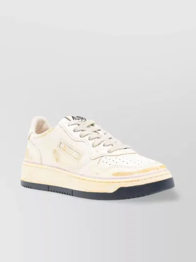 Autry Low-top Sneakers With Distressed Finish And Perforated Detailing In White