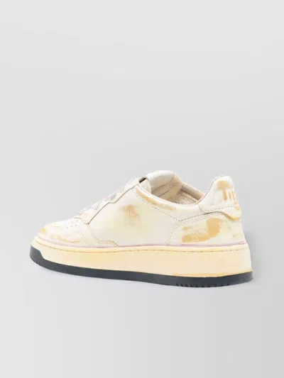 Autry Low-top Sneakers With Distressed Finish And Perforated Detailing In White